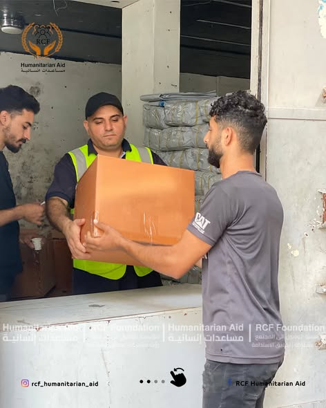 Handing over Karama Box to beneficiary